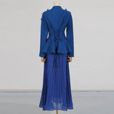 Blue outfit with a jacket and skirt on a mannequin against a plain background